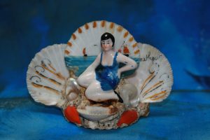 Southport - ceramic figure on painted shell